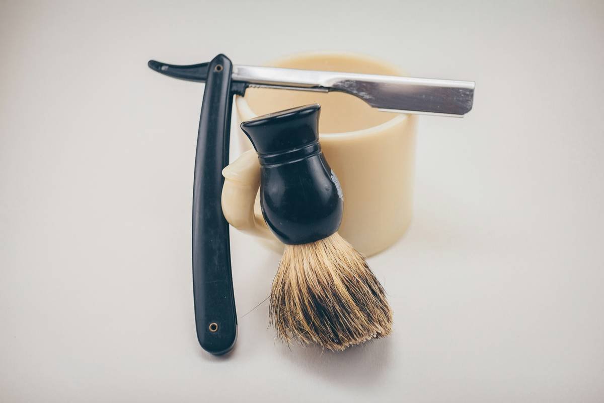 Before photo shows uneven, frayed beard edges; after photo shows crisp, clean lines using Japanese steel scissors