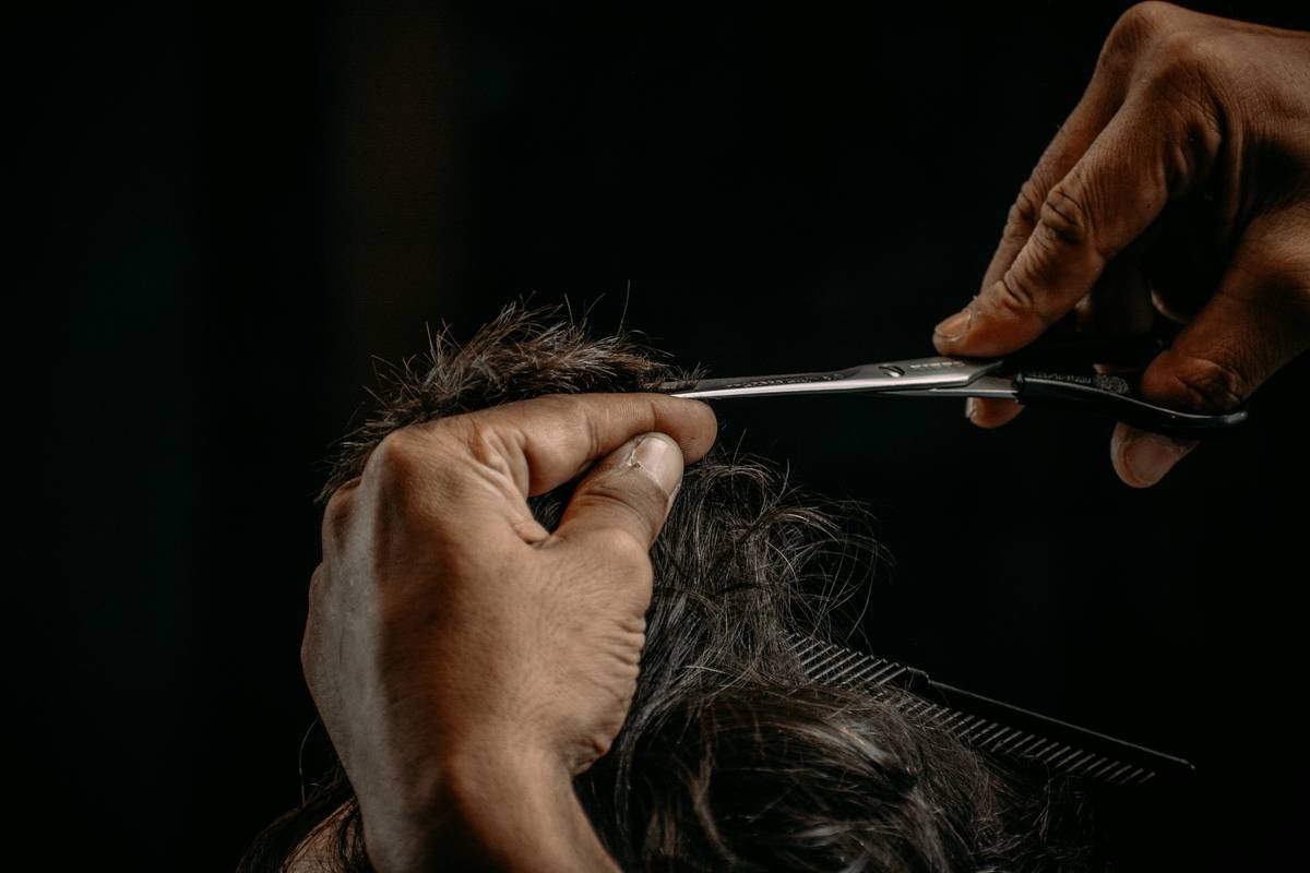 Diagram showing how beard hair and oils accumulate around scissor pivot point