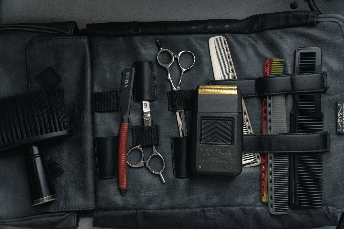 Beard scissors being honed on ceramic rod during DIY scissors maintenance